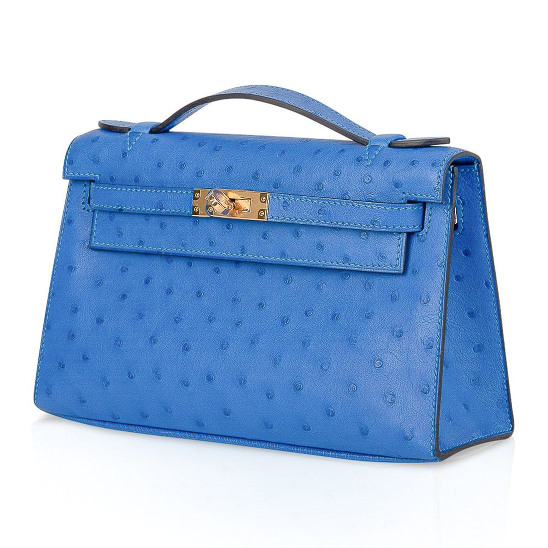 Bright Sky Blue Uniform Tiny Dotted Slim Elongated Rectangular Hand Clutch With Radiant Golden Twist Lock Flap Hardware And Thin Top Carry Grip
