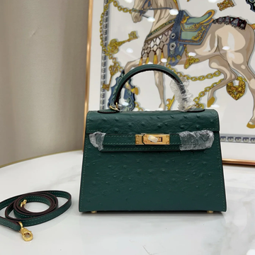 Deep Forest Emerald Green Evenly Dotted Compact Trapezoid Hand Carry Bag With Glowing Golden Twist Lock Hardware And Matching Suspended Metal Padlock Charm